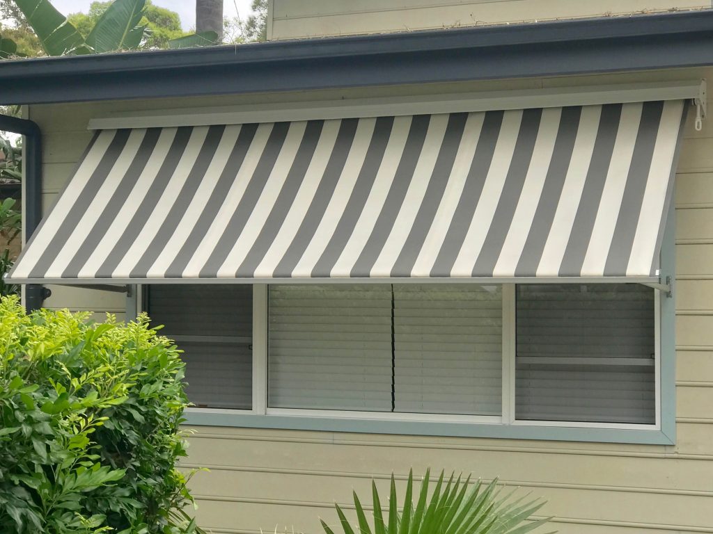 Heavy Duty Robusta Pivot arm awning with Over-Roll Hood by Jace Of Shades